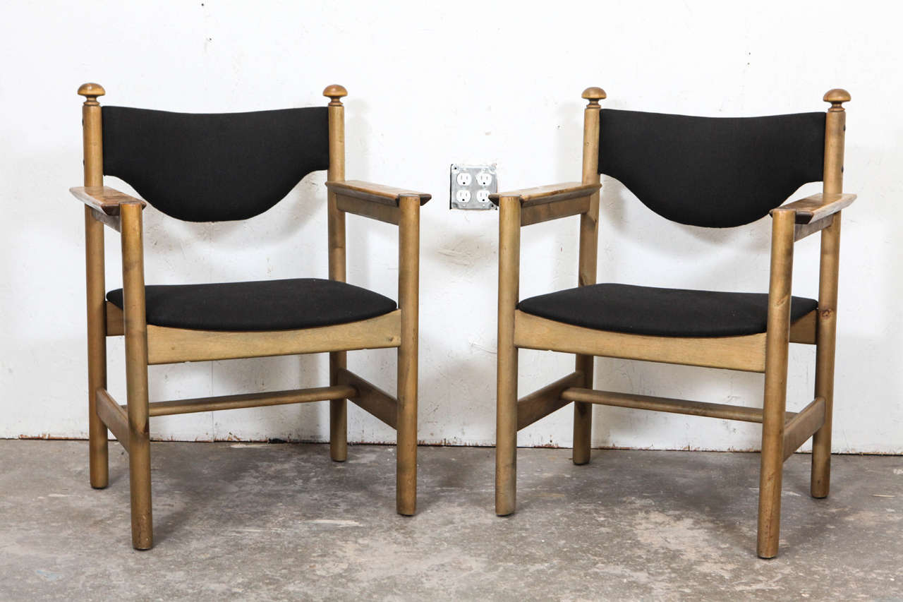 Six side and two arm chairs newly upholstered in black linen by Borge Mogensen.