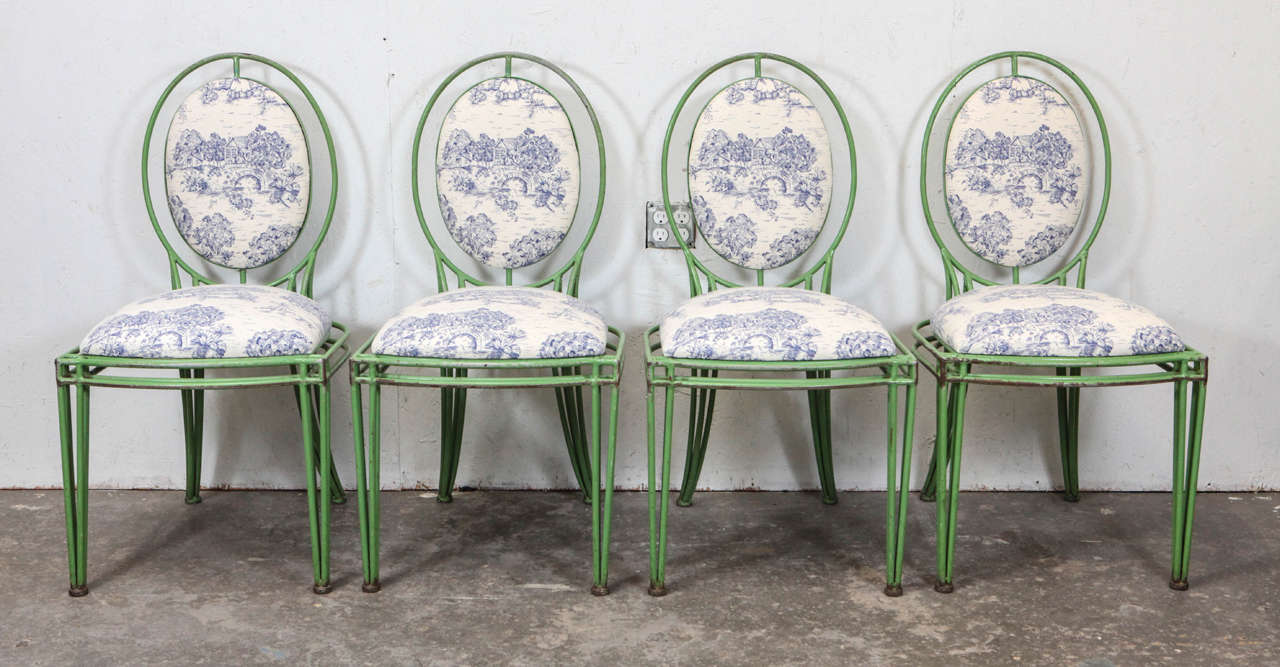 Exceptional rare and distinct dining chairs newly reupholstered in a blue and white toile.