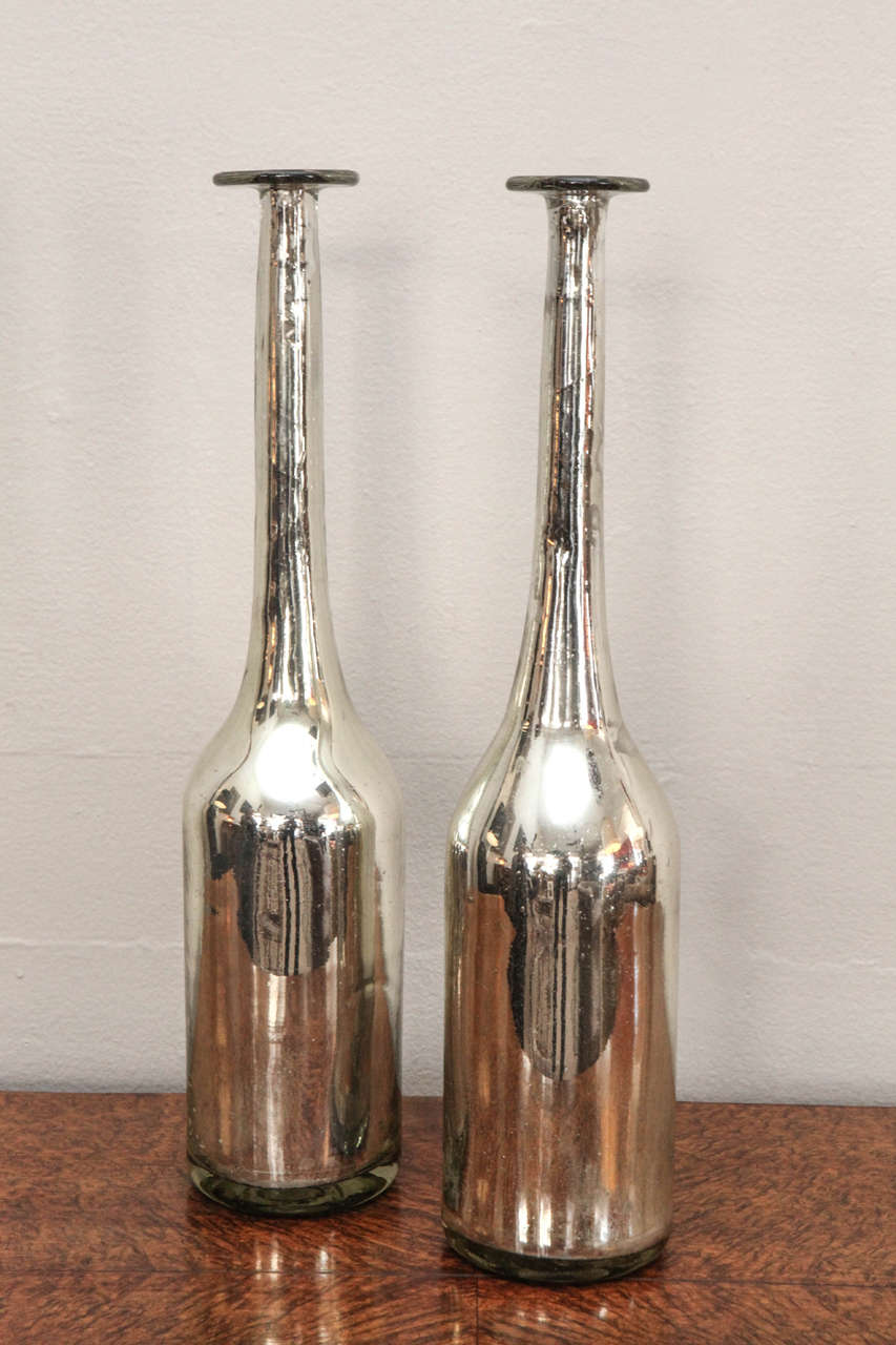 Nice old glass bottles.  Silver slightly mottled (age appropriate).  Priced individually at $475 each.