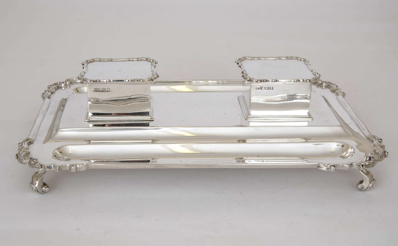 A large sterling silver 2-Bottle Inkstand, retailed by Mappin & Webb and hallmarked London 1918.
 It measures 32cms x 23.8cms.