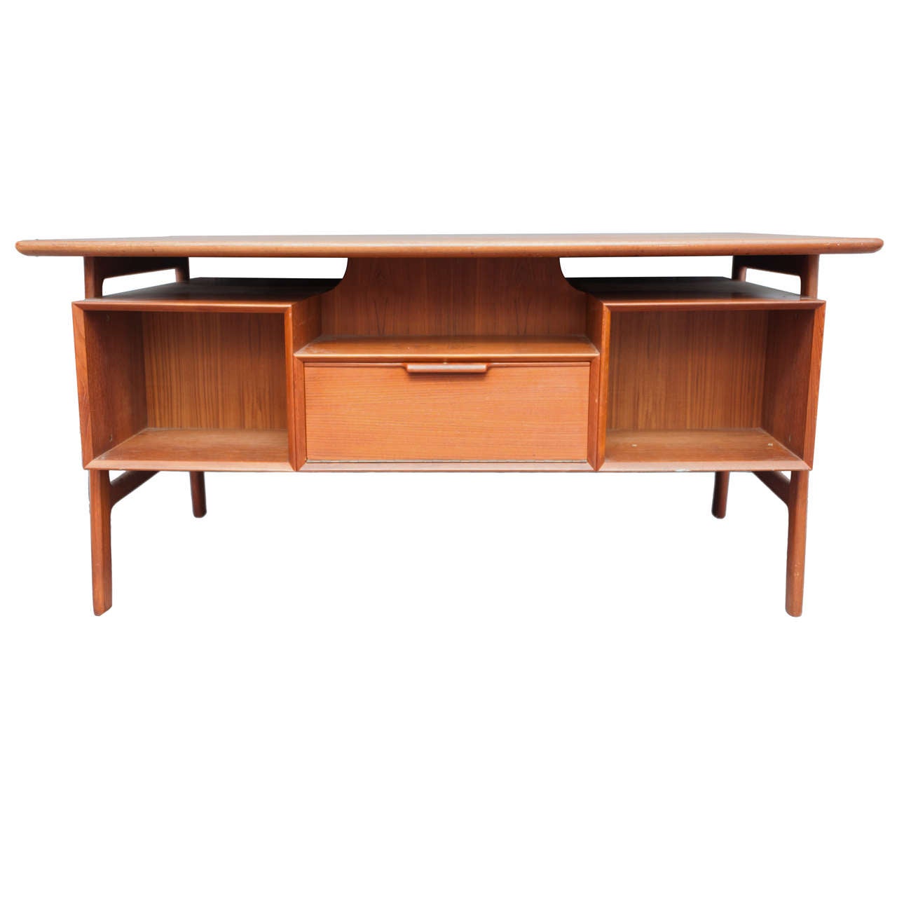 A Teak wood Danish free standing Desk, designed by Gunni Omann for Omann Junn. Model #75.
154cms wide x 84cms d
Danish
Circa 1960