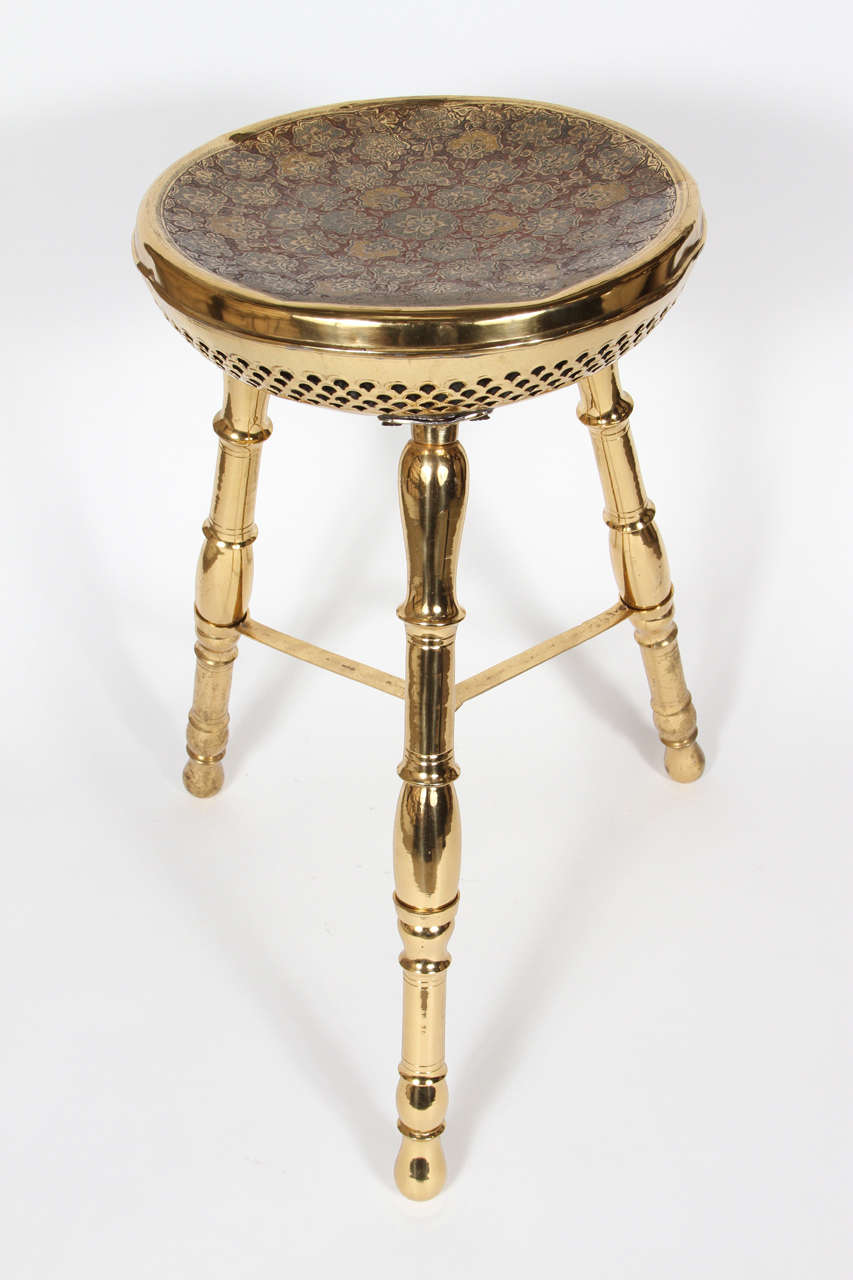 large unusual polished brass stool. Top hand chiseled and hand painted with cloisone floral designs.

Mosaik provides Antiques, Moorish Style, Spanish, African, Islamic Art, Arabian, Middle Eastern, Egyptian, Syrian Style,Anglo Indian, Asian