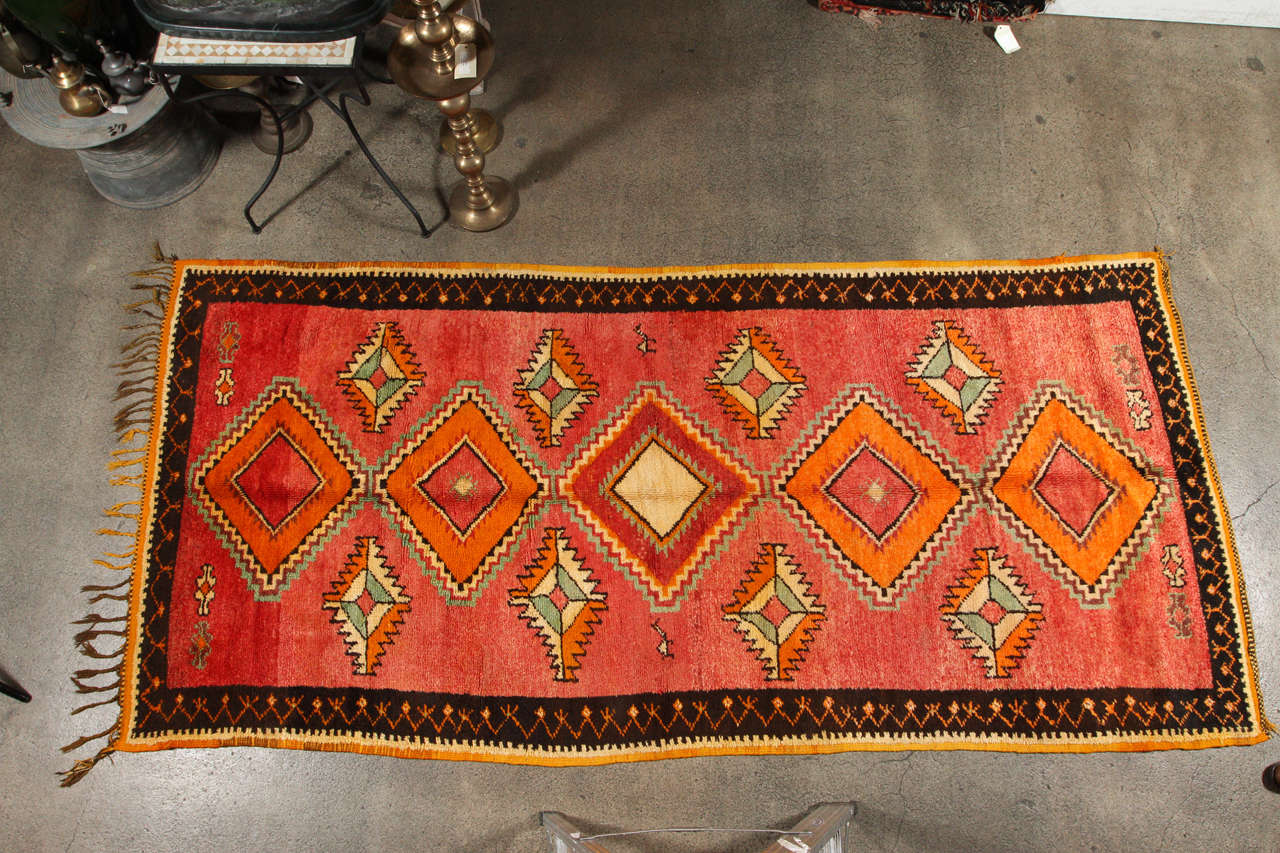 Unique vintage Tribal Moroccan rug runner, free style design, very modernist with bold colors in sage, oranges, cream, turquoise and pinks. Tribal powerful symbols. Looks like a Matisse works of Art. This wool carpet handwoven by the Berber women in