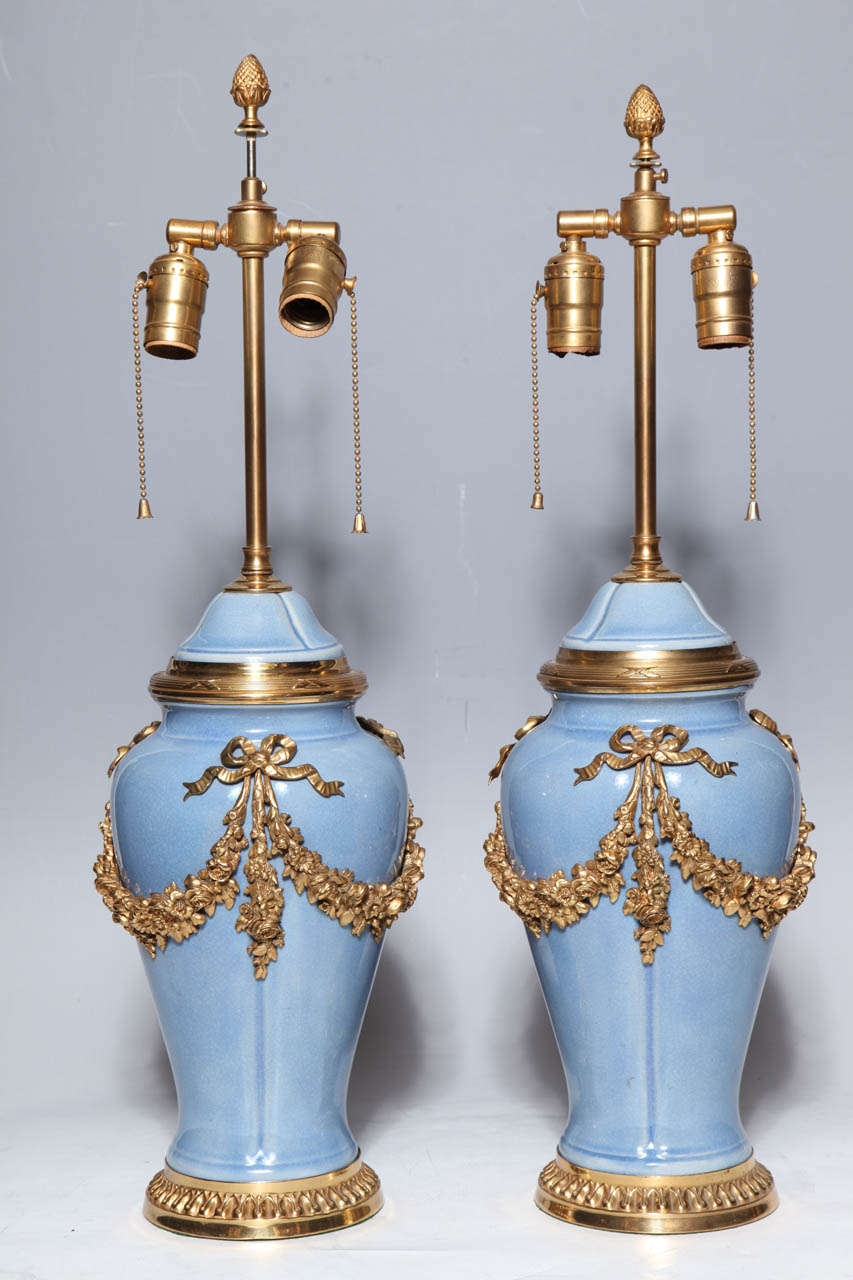A Fine Pair of Antique Louis XVI style Ormolu Mounted Chinese Export Porcelain Covered Vases Converted to Lamps.

This Pair of Large Chinese Export Vases are now Mounted as Lamps. The French were amongst the first Europeans to collect Chinese
