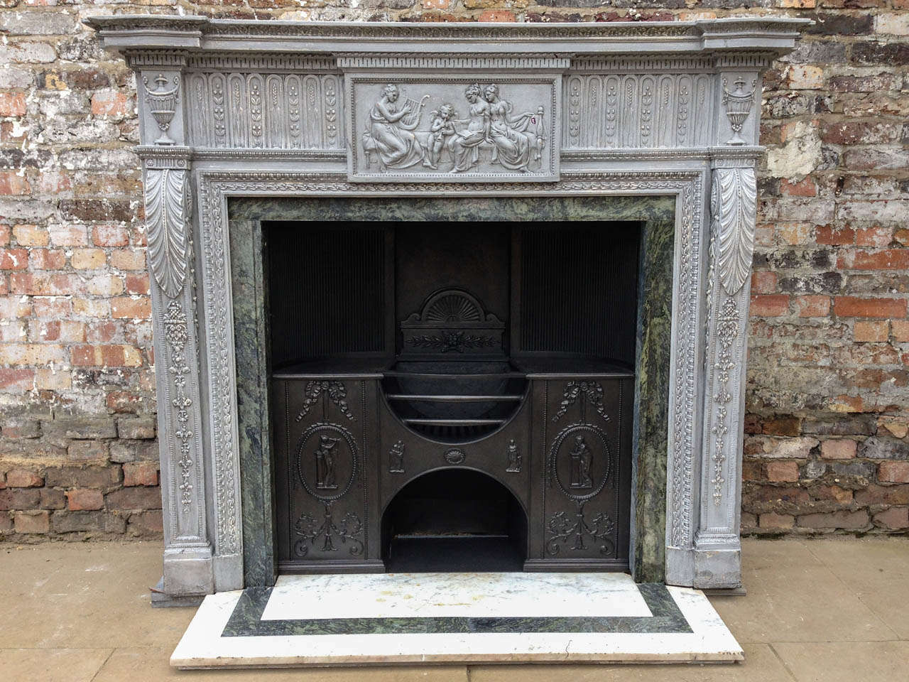 We are delighted to offer this spectacular carved pine and gesso Georgian chimney piece, in the Neoclassical manner of Robert Adam. The carvings and gesso castings are of the highest quality and typical of Robert Adam's late 18th century creations.