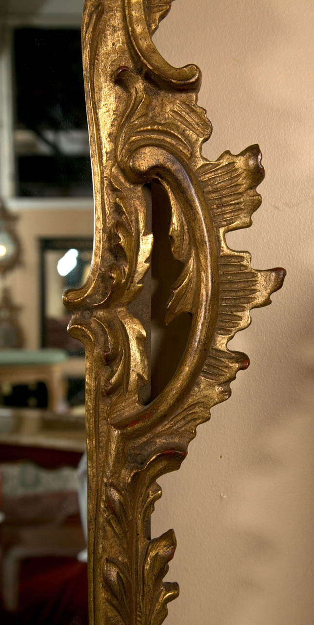 20th Century A Finely Carved Wall Mirror Adorning Carved Eagle