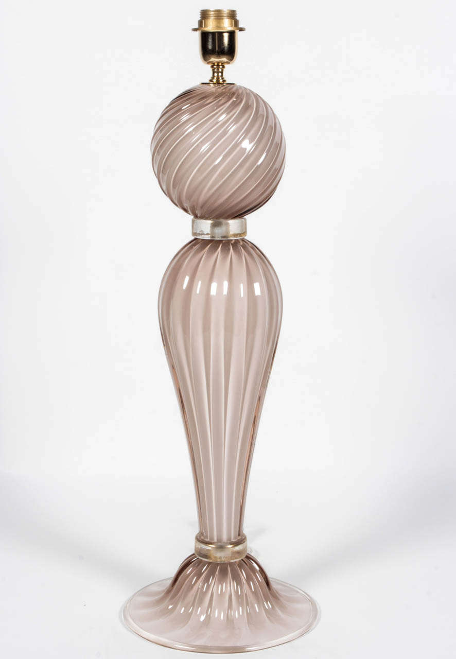 Beautiful pair of handblown Italian Murano rose or pink (depending on how you see it) glass lamps. 23k gold infused glass rings separate each of the pink glass globes. Absolutely exquisite. Wired for U.S. These lamps on display at the 1stdibs floor