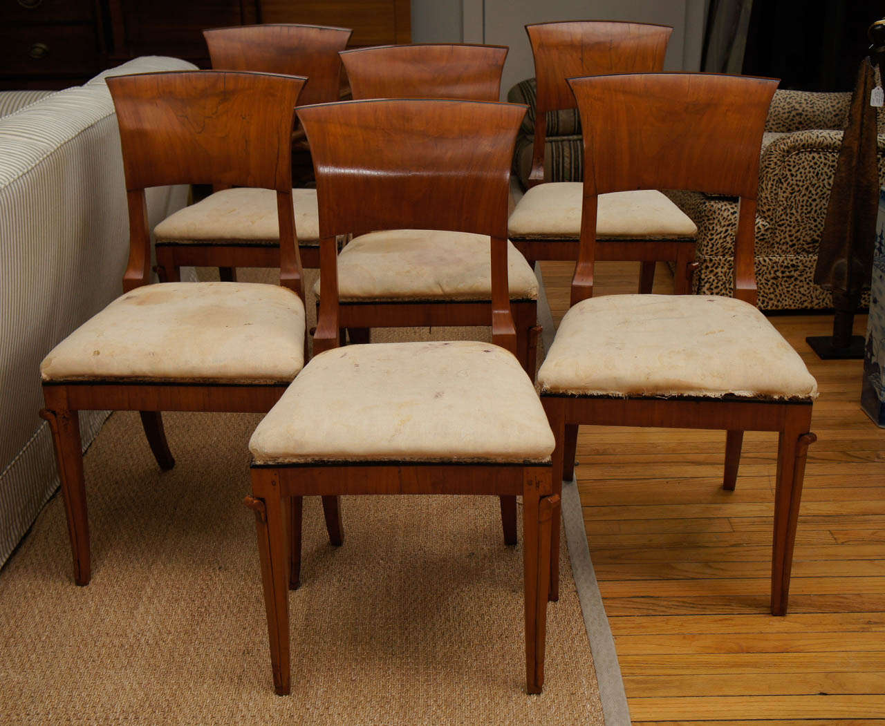 Set of six Italian Empire walnut chairs with finely carved details.
Original seats need reupholstering.
34