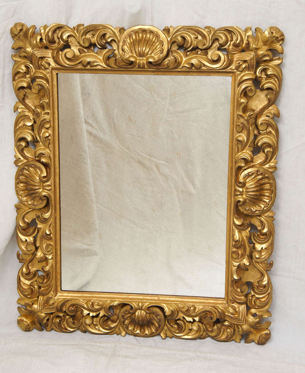 Intricately carved Italian frame with original gilt.