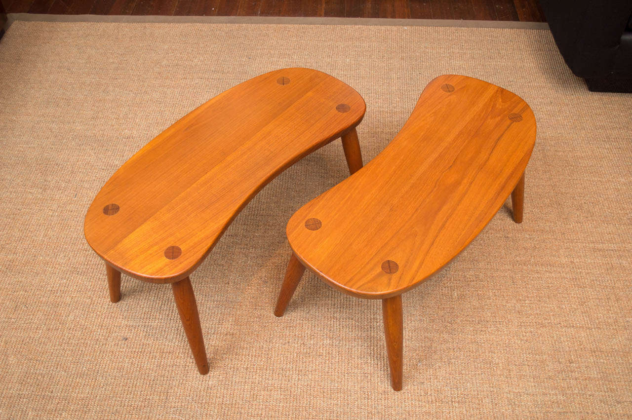 Pair of sculptural side tables or stools made of solid teak and retailed at Ilums Bolighus, Denmark.