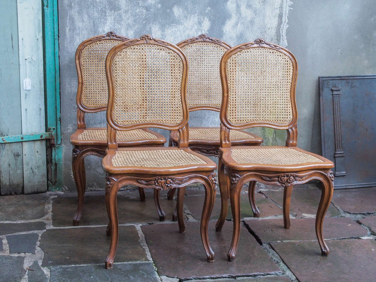 Set of eight exceptionally well-executed French walnut and cane dining chairs in the Louis XV taste, with carved decoration, circa 1900
