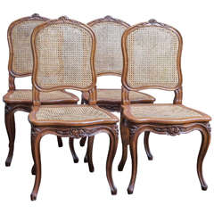 Eight French Walnut and Cane Dining Chairs, circa 1900