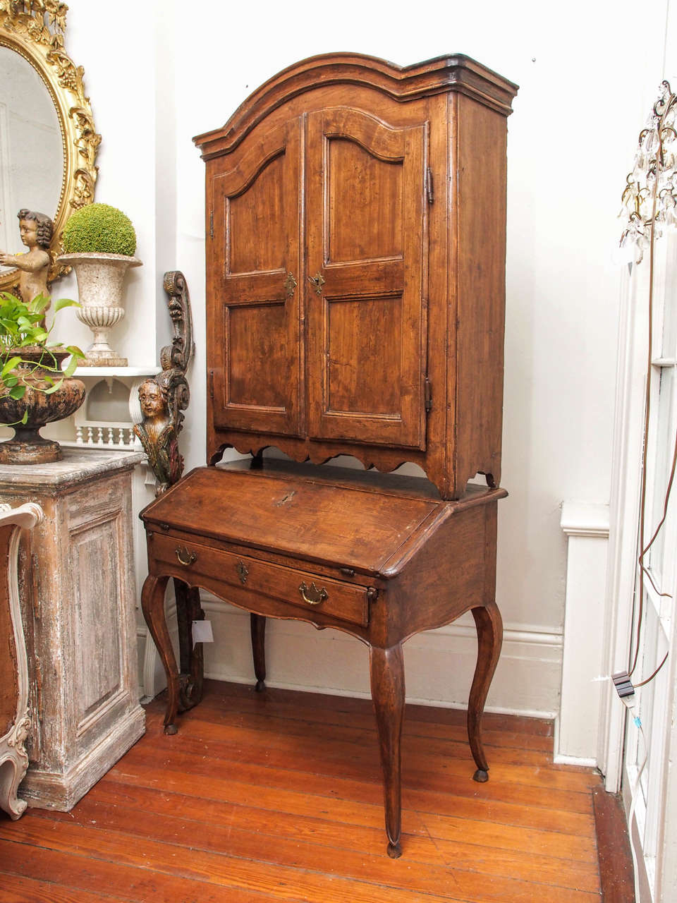 Early 19th Century walnut 2 parts French writing desk . Bottom part opens with a front drop desk with one drawer.  Cabriole legs. Top part is a bookcase with 4 shelves.