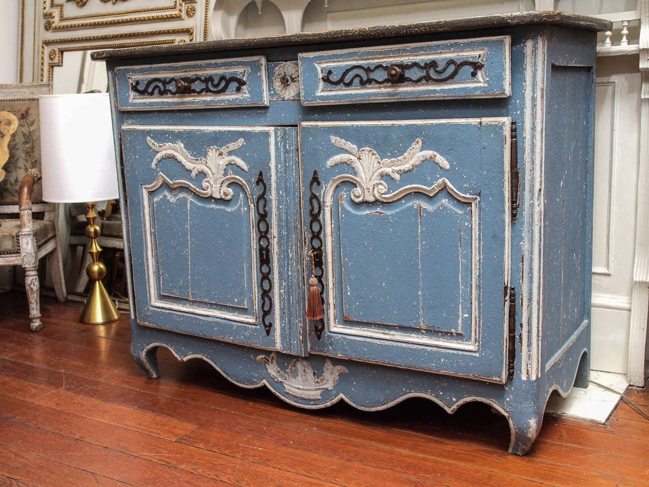 Early 19th century walnut two doors, three drawers (one very small one in the center) painted buffet. Louis XV style. Flower basket motif at the bottom center. Painted in blue and cream. Top is a charcoal color.