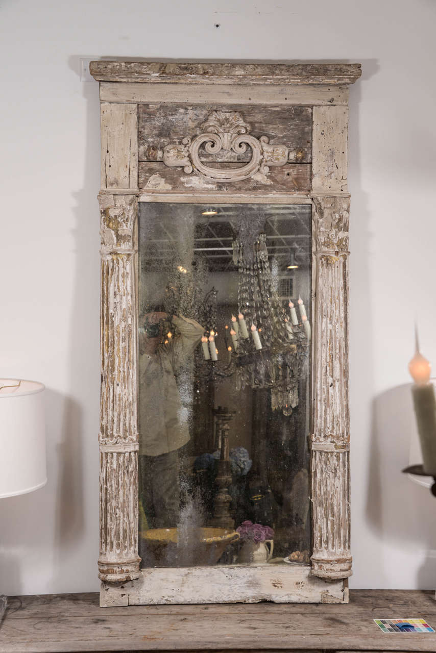 Creamy white painted mirror, from 18th century altar elements, with remnants of original paint and gilding.