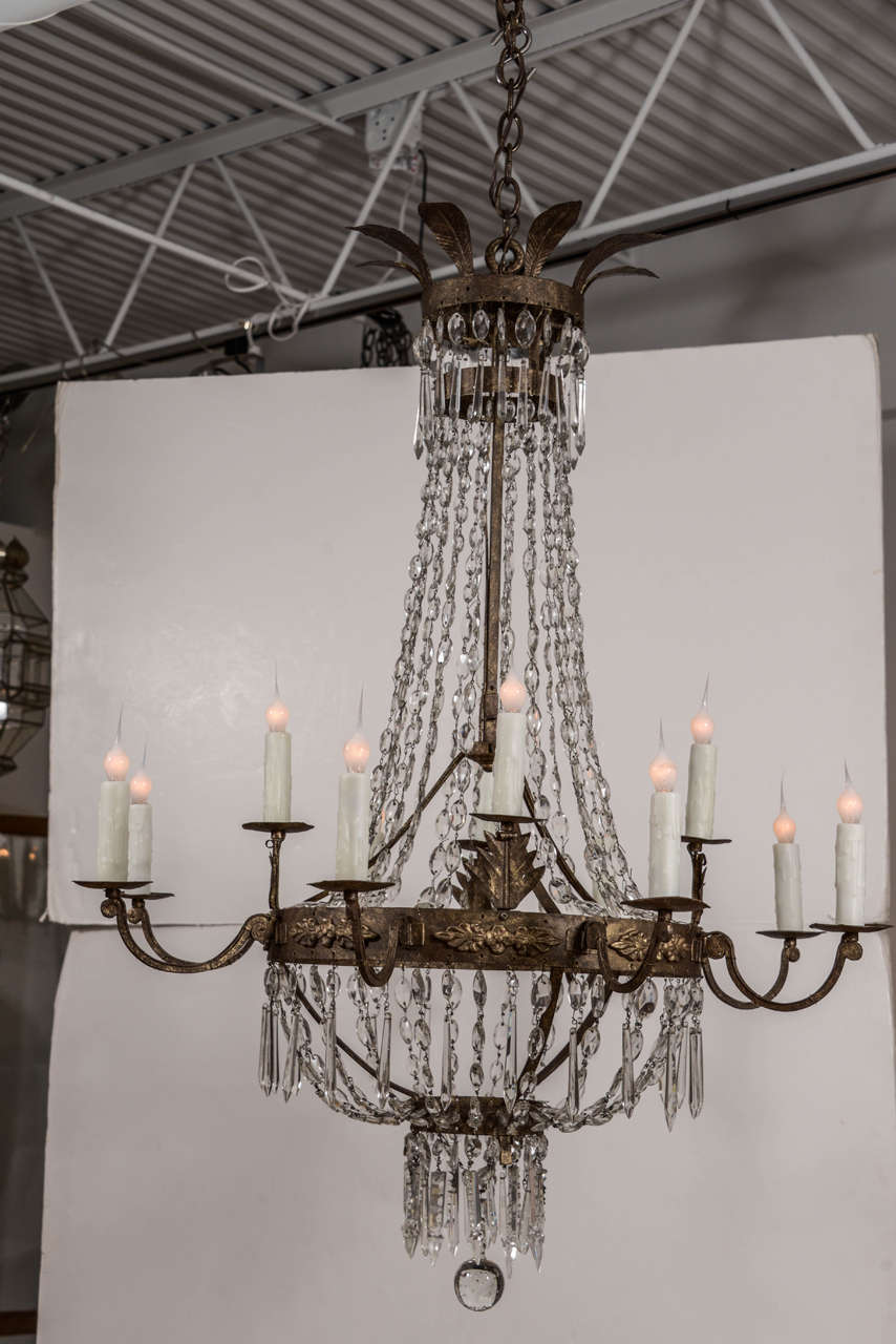 19th century Italian gilt iron and crystal, newly wired with twelve lights, extra chain and a canopy.