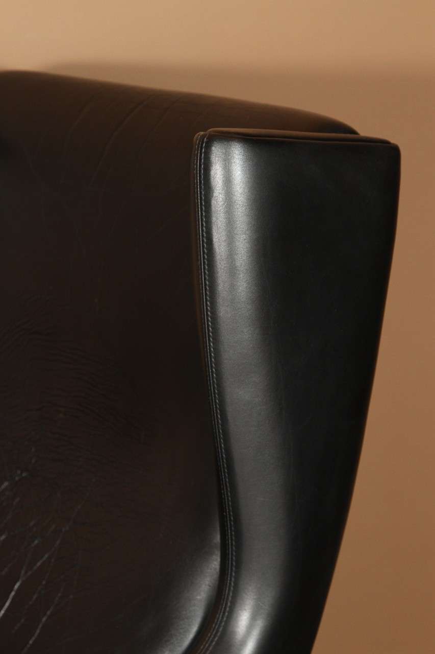 Mid-20th Century Illum Wikkelsø model 110 Black Leather Chair with Ottoman