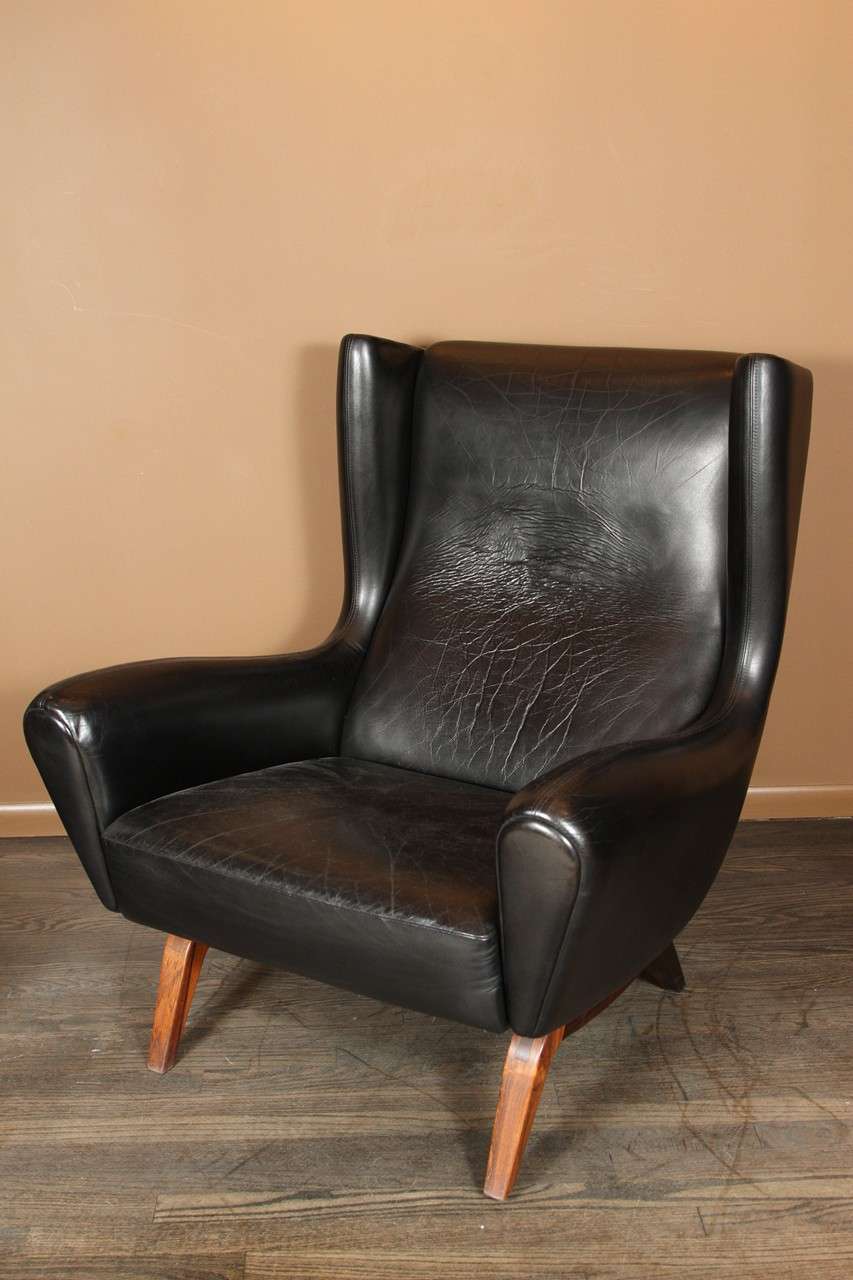 Illum Wikkelsø model 110 Black Leather Chair with Ottoman 1