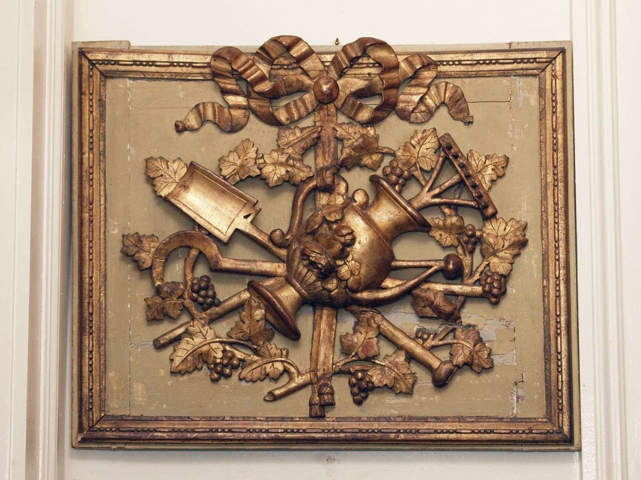 French Louis XVI Gilt Carved Wood Architectural Overdoor Plaque of Garden Implements and ribbon. Exceptional quality.