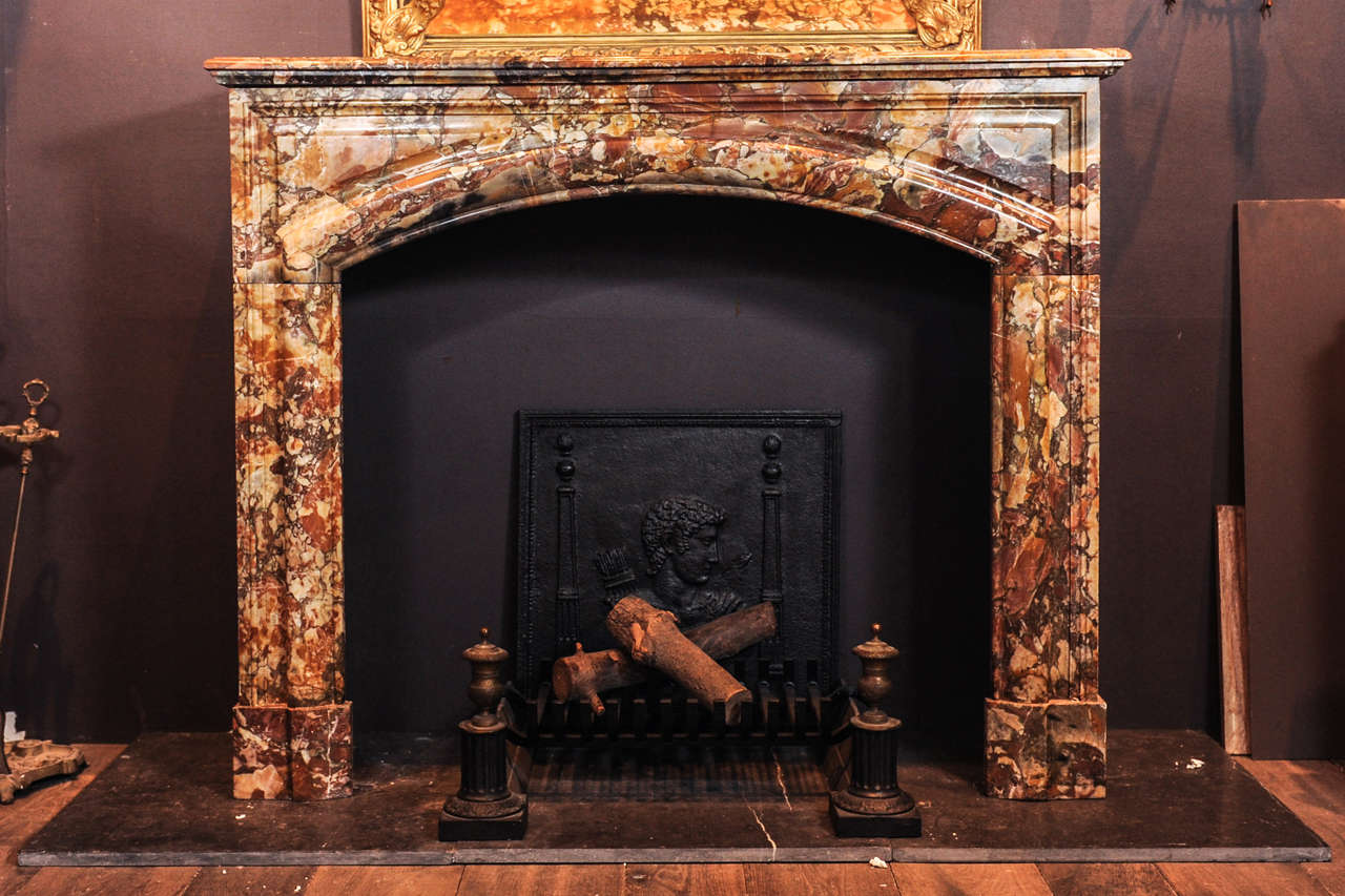 19th century fireplace in beautiful warm shades of Sarrancolin marble.