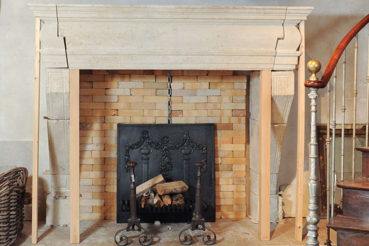 A large 17th Century French limestone castle fireplace / mantel piece