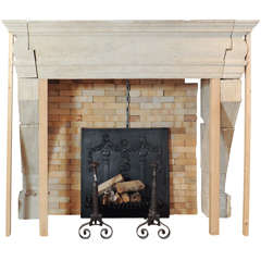 A large 17th Century French limestone castle fireplace / mantel piece