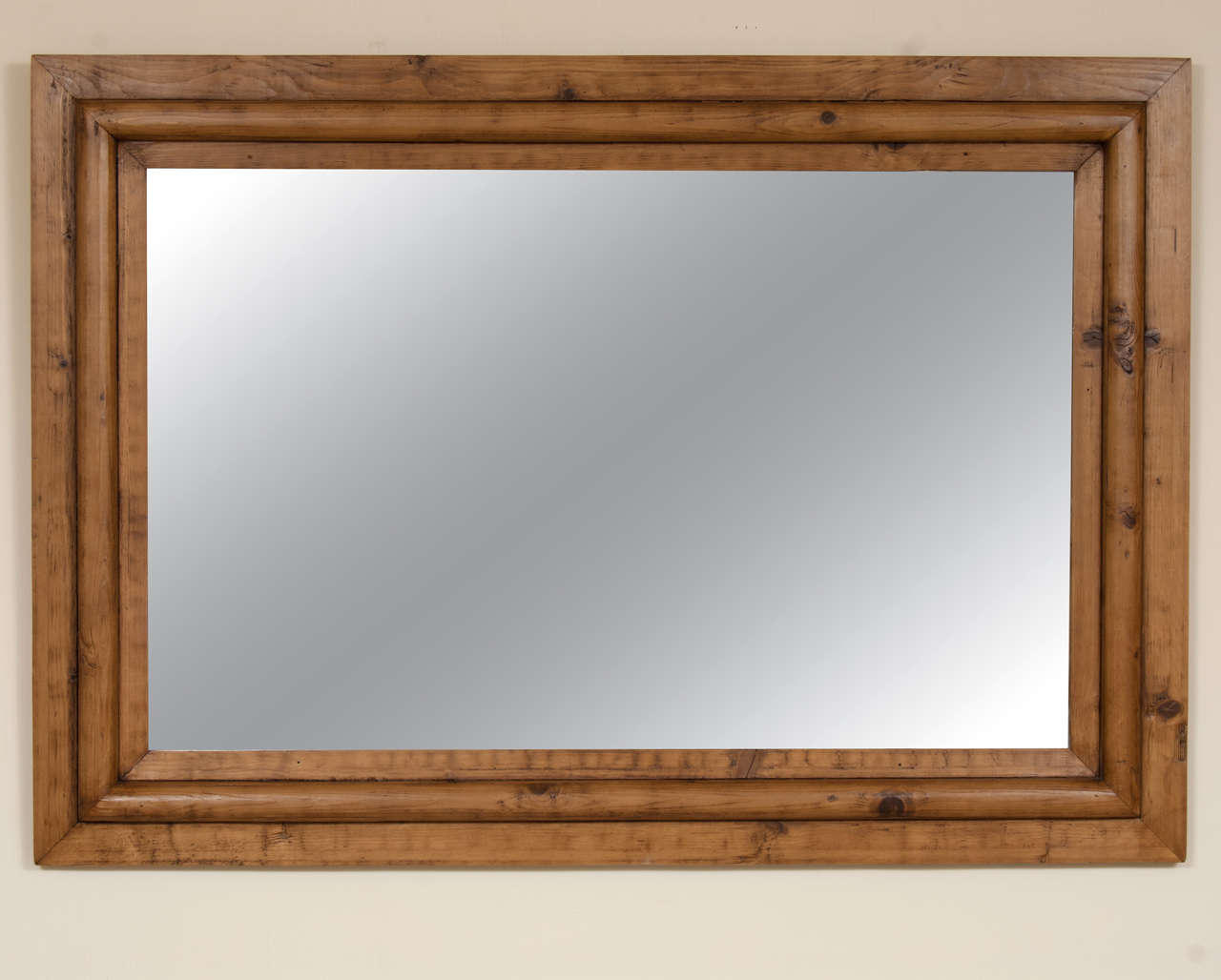 An unusually large and bold hard-to-find original antique pine mirror frame with replaced mirror glass.
