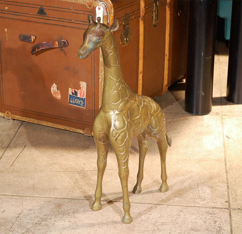 TWO 1970'S LARGE BRASS GIRAFFES SCULPTURES.<br />
DIMENSION