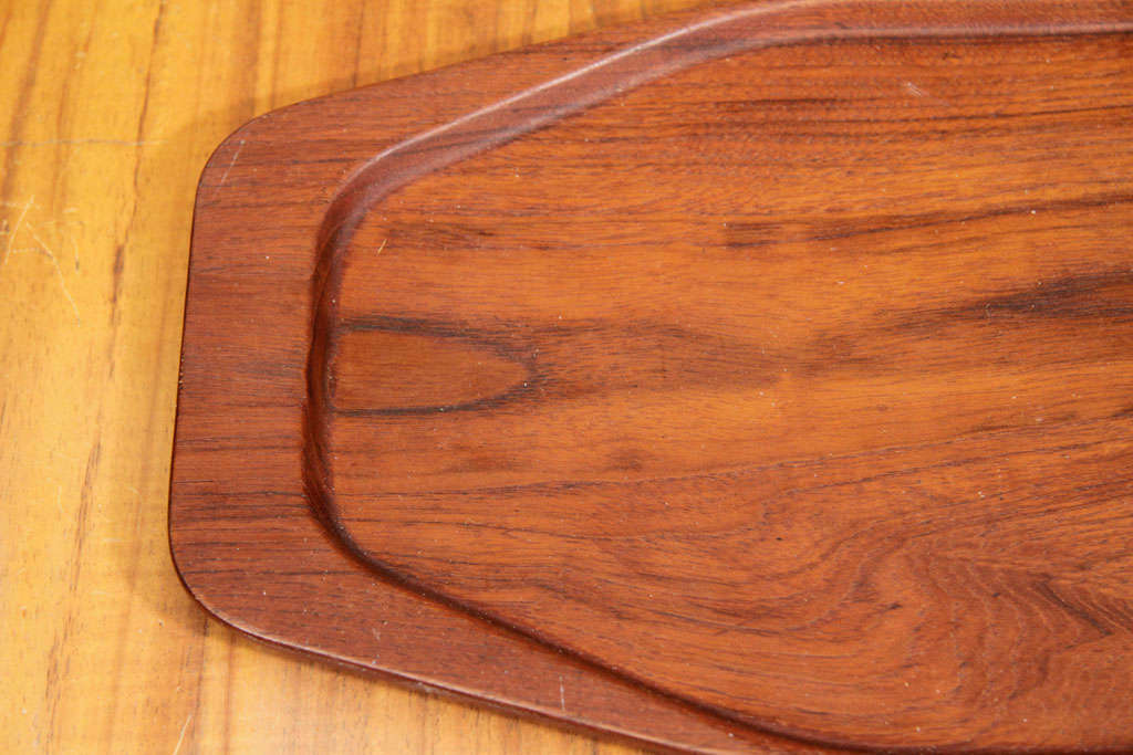 Teak serving tray with border by Digsmed, Denmark, circa 1960. Signed.

Dimensions: 22.5 inches L x 8.5 inches W