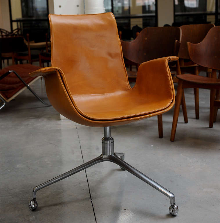 Original 3-legged version “Bird” office chairs made with brushed steel and leather; Unmarked.