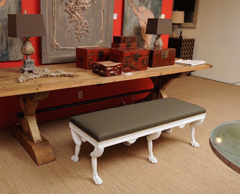 A carved and painted bench