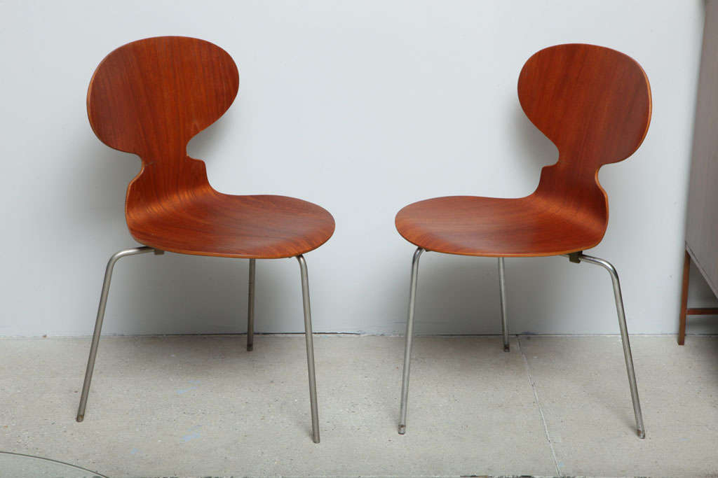 Pr. of molded teak faced plywood and steel Ant chairs, model 3100, manufactured by Fritz Hansen. Stamped and labeled.
