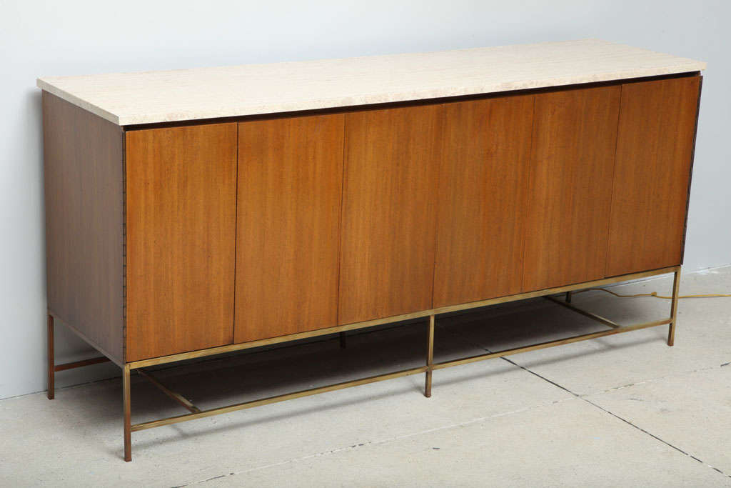 Fine quality Paul McCobb credenza/server with screen fold doors, Roman travertine top, brass square frame base. Model 7306-C from the Irwin collection for Calvin.