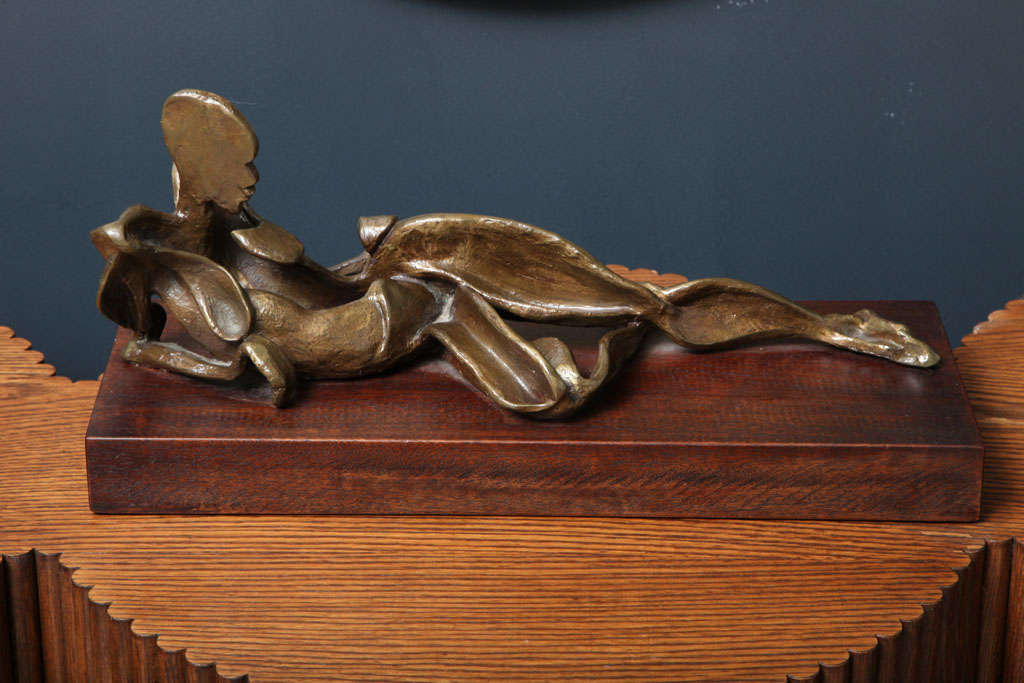 Fine quality bronze model of a reclining female figure mounted on a hardwood base signed Rodelinde 1985.