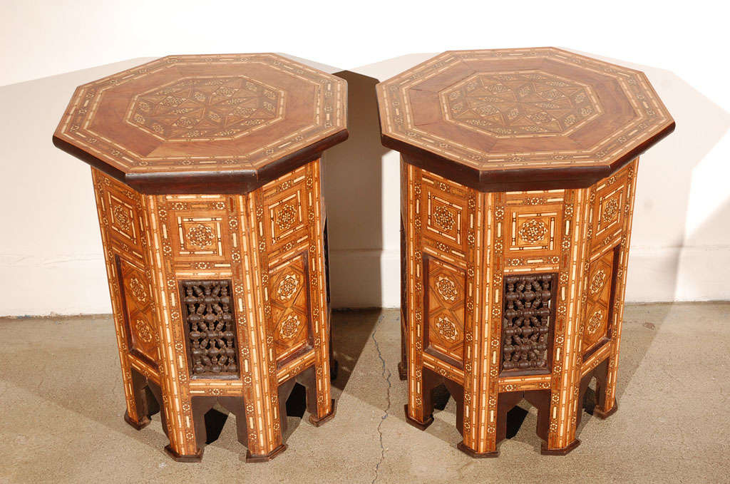 Handcrafted Hispano Moresque elegant pair of mosaic occasional side tables.
Beautifully patterned in intricate inlay of different kind of fruitwood.
Nice Mousharabie lattice work on each sides
All inlayed to perfection to create the Moorish style