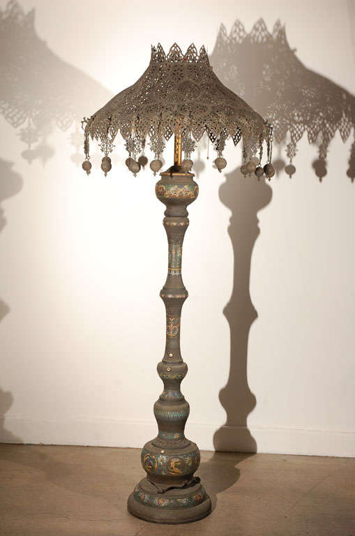 19th Century Oriental Floor Lamp,dark bronze patina with colorful cloisonne enamel and inlaid geometric and stylized flowers decoration. Imposant Shade with intricate filigree work and adorned with bronze pendants

Lamp total Heigh is 80