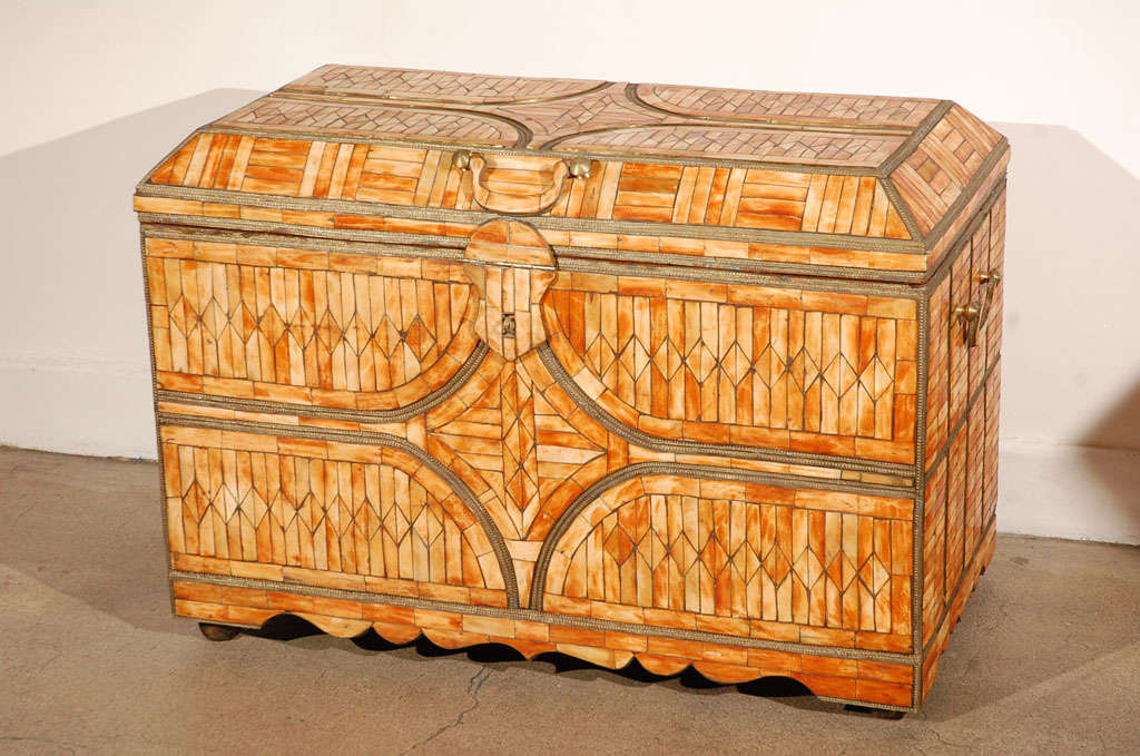 Spectacular large handcrafted Hispano Moresque style dowry coffer heavily inlaid with camel bone and brass.
Moroccan Moorish wedding dowry floor chest finely detailed and hand-carved all-over with brass and camel bone inlaid, brass handles and