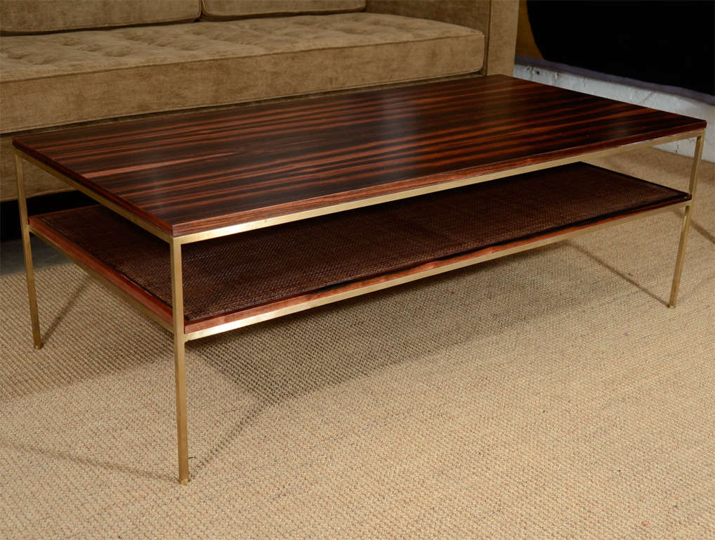 reGeneration New Line coffee table with solid brass frame, macassar ebony top, and caned shelf as shown. This is the last one available.