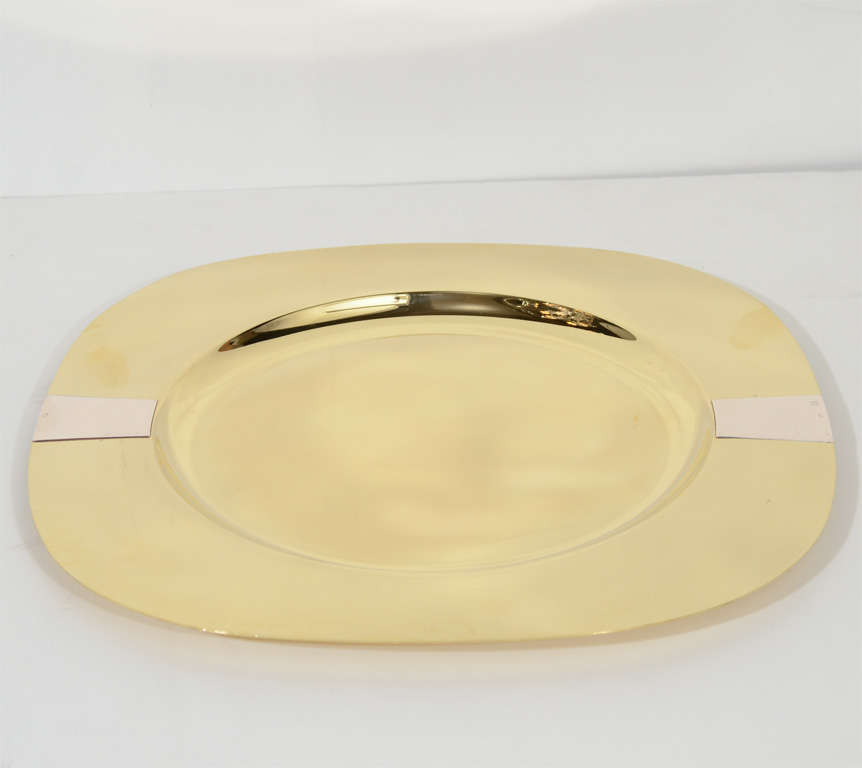 This set of 4 brass and sterling charger plates are of a rounded square form with two bands of sterling on brass. These would also be gorgeous as platters as well. They are marked A/S 925 sterling