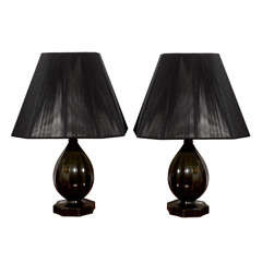 A Pair Of Patinated-Disko Metal Lamps by Just Anderson