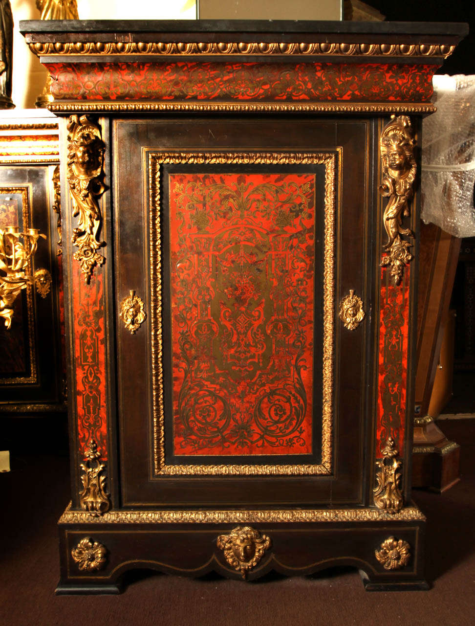 Pair of Napoleon III cabinets in tortoise-shell and bronze Boulle marquetry. Black marble top. Good condition. Normal wear consistent with age and use.