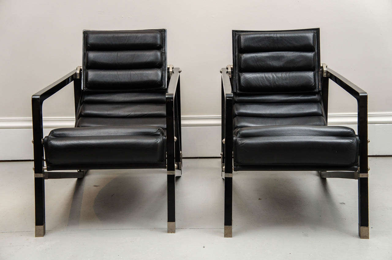 Eileen Gray designed the chair based on the classic deck chair. These chairs are a perfect example of the Modernist Movement of form and function. The chairs are nickle plated steel, black lacquered wood and leather. Very comfortable to sit in