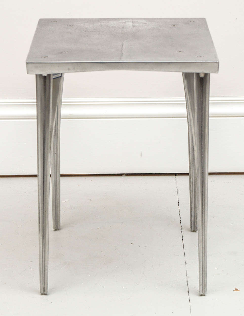 Handsome side or occasional table designed by Robert Josten. The table is sand cast aluminum and polished aluminum.