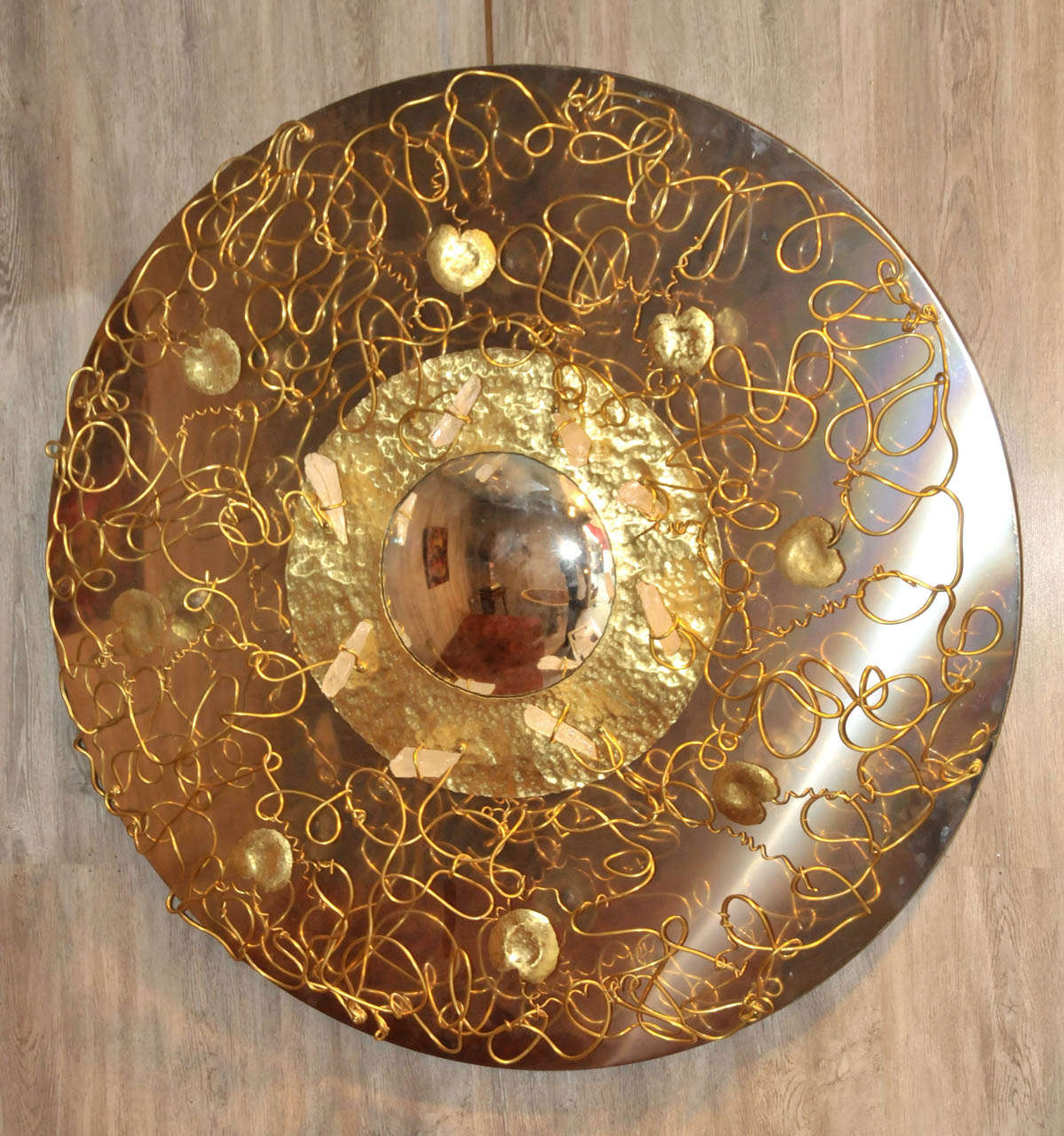 1990's circular mirror. Gilded brass and convex mirror. Rock cristal and wood structure. Good condition. Normal wear consistent with age and use.