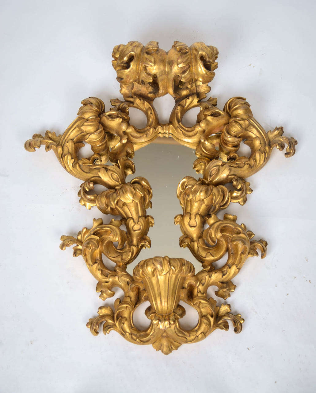 Particularly fine pair of hand-carved 19th century Florentine giltwood three-light girandoles in the Rococo manner, with elaborately shaped open scrolled acanthus leaf frames.
(Arms missing).
