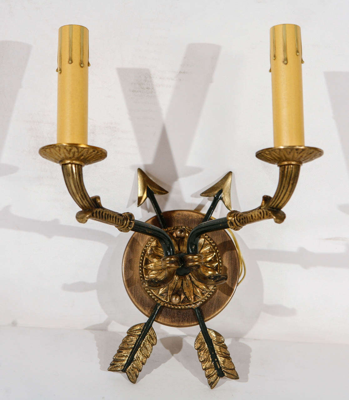 A stunning set of vintage four bronze arrows sconces from France in the style of Maison Jansen.