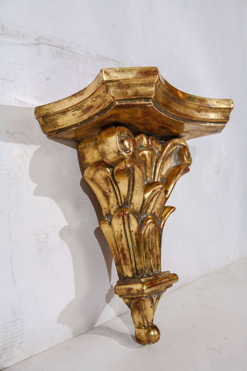 A decorative pair of Italian hand carved gold leafed brackets.