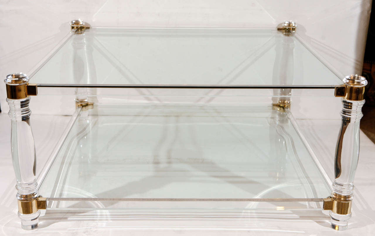 A wonderful mid century Lucite, glass and brass coffee table. Legs and frames are Lucite and Brass. Tops are glass.