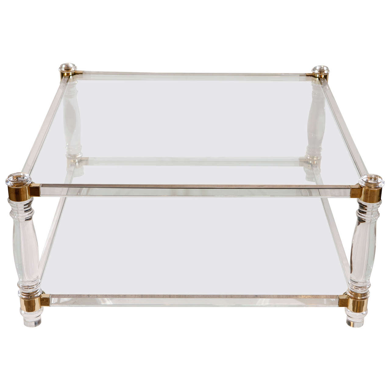 A Mid Century Lucite and Brass Coffee Table