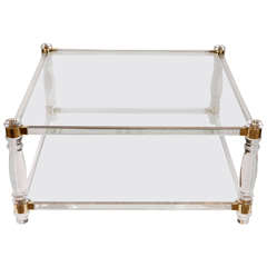 A Mid Century Lucite and Brass Coffee Table